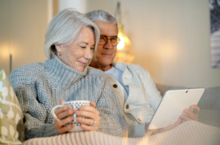 An elderly couple reviewing their coverage together at home